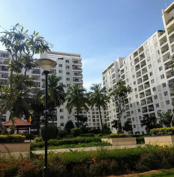 High-rise towers and gardens inside a gated society in Bellandur